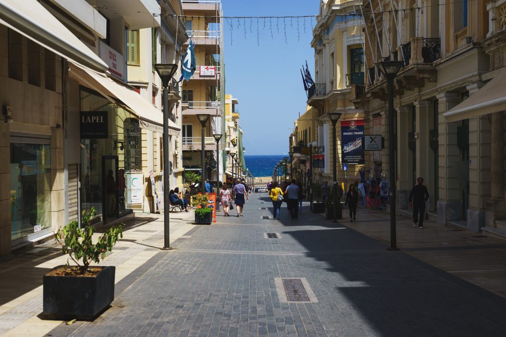 Heraklion, Greece, April 2018. Streets of Heraklion, Greece. Warm, sunny day in a Greek city. Walk around the city on a summer day with a view of the sea. Souvenir shops and gifts for tourists and travelers.