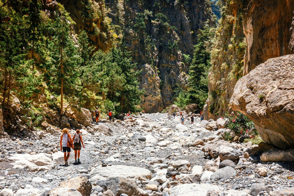 Chania, Crete, Greece, May 26, 2016: Tourists hike in Samaria Gorge in central Crete, Greece. The national park is a UNESCO Biosphere Reserve since 1981